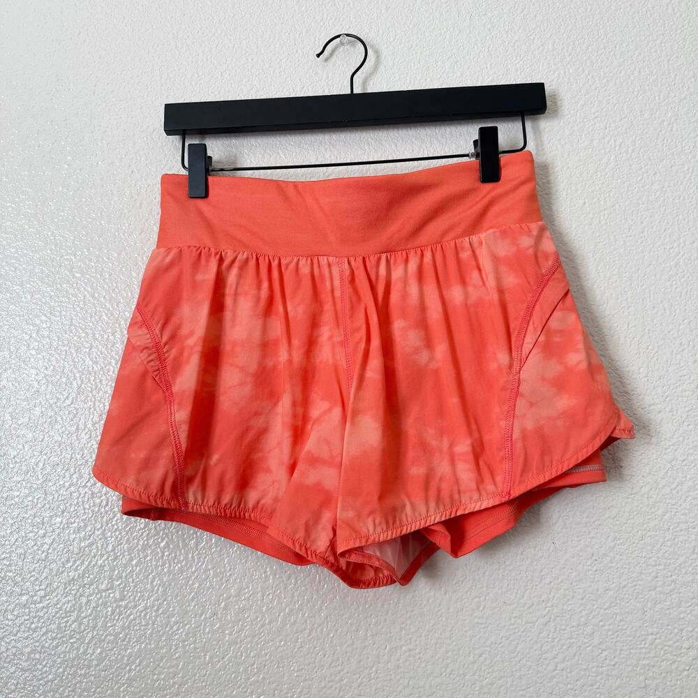 Fabletics Austyn Run Short Coral Haze Static Reflective Silver Orange pocket